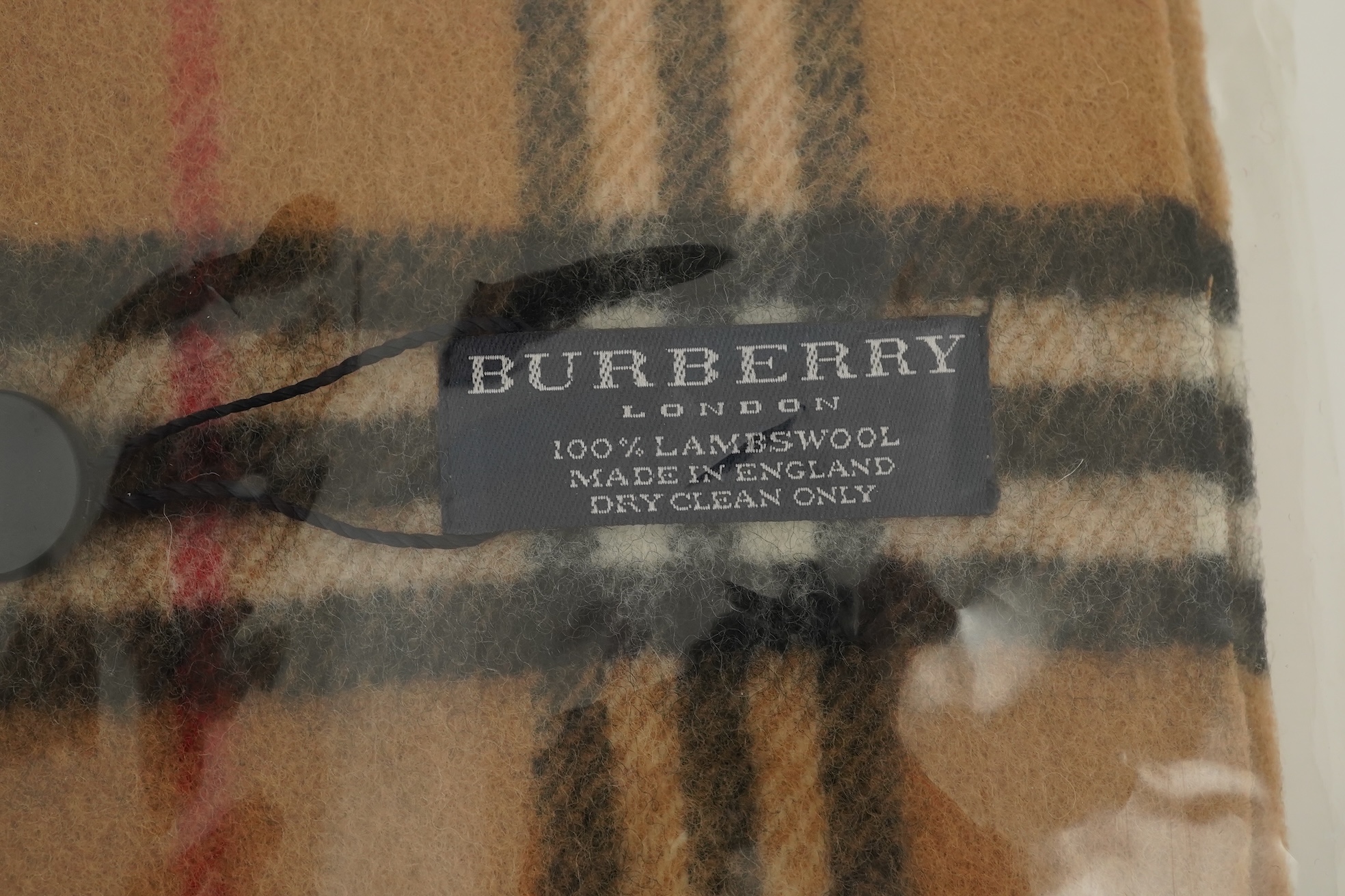 A Burberry brown tartan scarf, sunglasses with case and wallet with original box.